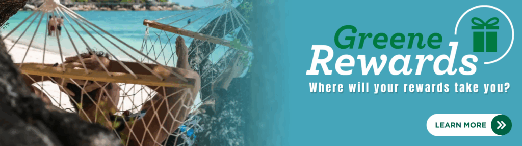Man relaxing in hammock on beach