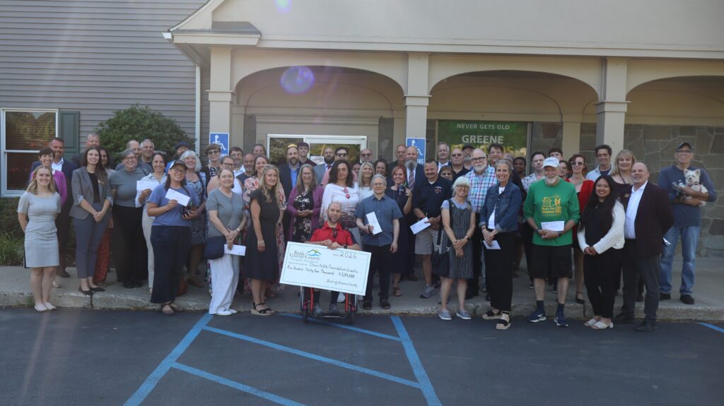 Kingston branch charitable ceremony group picture with big check