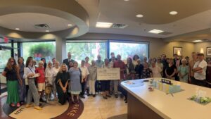 Copake branch charitable ceremony group picture with big check