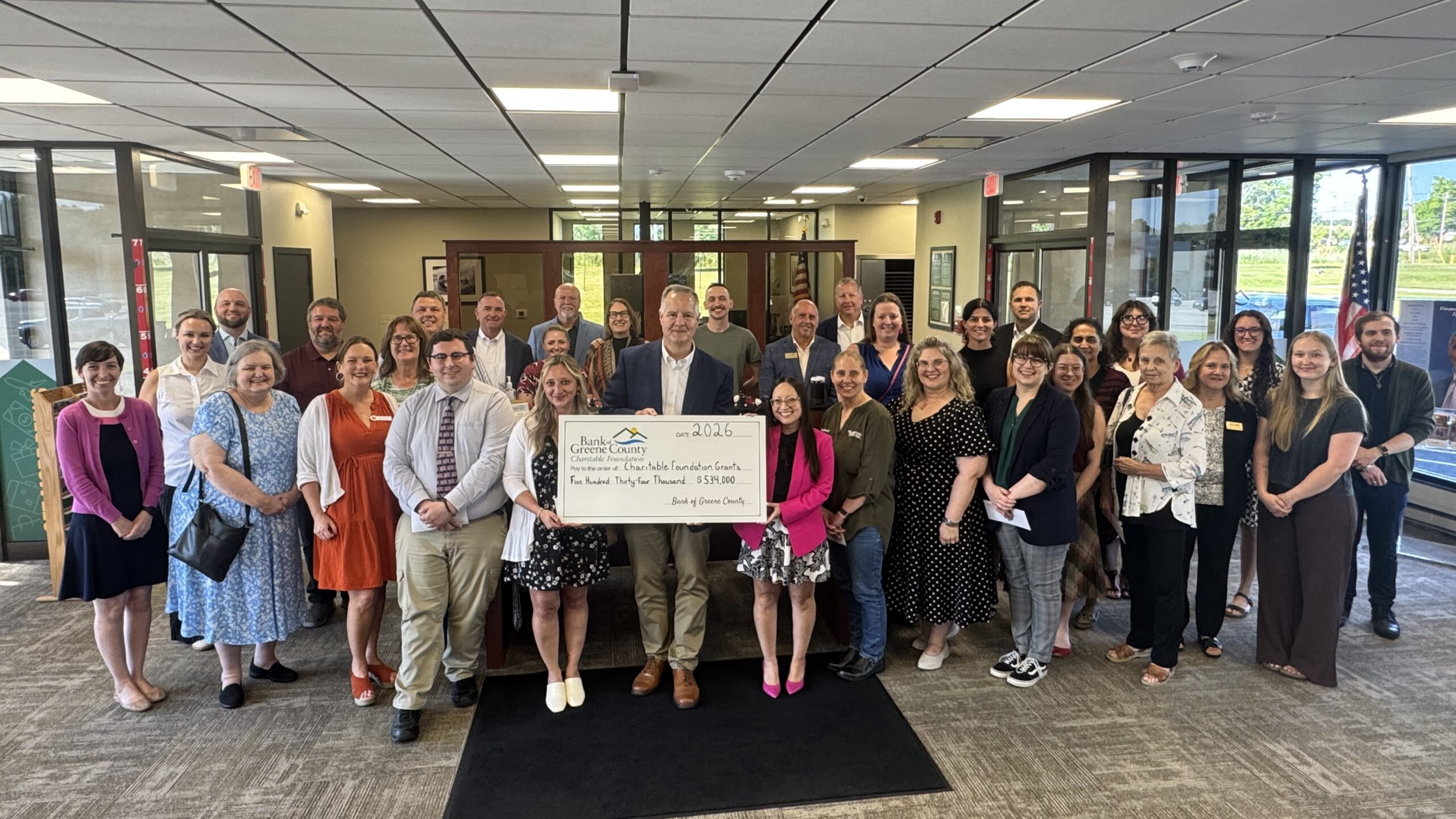 Clifton Park branch charitable ceremony group picture with big check